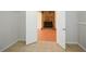 Open doorway displaying a living room with stone fireplace, tile floor and neutral walls at 3667 Humphries Hill Rd, Austell, GA 30106