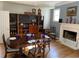 Formal dining room with a fireplace, hardwood floors, furniture and ample space for entertaining at 5440 Cameron Forest Pkwy, Johns Creek, GA 30022