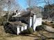 View of the back of the house with plenty of trees around at 5440 Cameron Forest Pkwy, Johns Creek, GA 30022