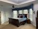 Spacious primary bedroom with tray ceiling, large windows for natural light and an ensuite bathroom at 5440 Cameron Forest Pkwy, Johns Creek, GA 30022