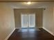 Bright dining area with dark hardwood floors and French doors at 6048 Old Wellborn Trce, Lithonia, GA 30058