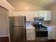 Kitchen with stainless steel appliances and white cabinets at 6048 Old Wellborn Trce, Lithonia, GA 30058