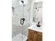 Modern bathroom with marble shower, freestanding tub, and a stylish wood vanity at 1045 Ridgecrest Se Dr, Smyrna, GA 30080