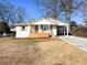 Newly renovated home with a covered porch and a spacious yard at 1045 Ridgecrest Se Dr, Smyrna, GA 30080