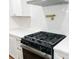 Modern gas range with stainless steel appliances at 1045 Ridgecrest Se Dr, Smyrna, GA 30080