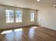 Spacious living room with hardwood floors and large windows at 1045 Ridgecrest Se Dr, Smyrna, GA 30080