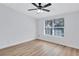 Bright bedroom with wood-look flooring and a large window at 2918 Fields Dr, Lithonia, GA 30038