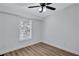 Bright bedroom with wood-look flooring and a large window at 2918 Fields Dr, Lithonia, GA 30038