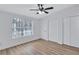 Bright bedroom with wood-look flooring and a large window at 2918 Fields Dr, Lithonia, GA 30038