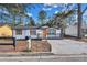 Newly renovated single story home with modern gray accents and wood shutters at 2918 Fields Dr, Lithonia, GA 30038