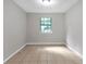 Simple bedroom with tile flooring and a window at 3589 Satellite Blvd, Ellenwood, GA 30294