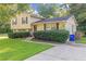 Two-story house with a spacious driveway and lush lawn at 3589 Satellite Blvd, Ellenwood, GA 30294