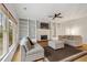 Living room featuring built-in bookcases, fireplace and hardwood floors at 450 Surveyors Pt, Suwanee, GA 30024