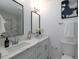 Modern bathroom with double vanity, marble tile, and black accents at 6030 Danbury Ct, Morrow, GA 30260