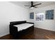 Bedroom with daybed, hardwood floors, and geometric wall art at 6030 Danbury Court, Morrow, GA 30260