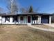 Charming ranch home features white brick, dark trim, and a red door at 6030 Danbury Court, Morrow, GA 30260