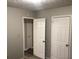 Simple bedroom with neutral walls and ample closet space at 1079 Salisbury Trl, Riverdale, GA 30296