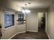 Simple dining room with laminate flooring and neutral walls at 1079 Salisbury Trl, Riverdale, GA 30296