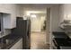 Eat-in kitchen with stainless steel appliances and laminate floors at 1079 Salisbury Trl, Riverdale, GA 30296