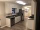 Bright kitchen with stainless steel appliances and laminate flooring at 1079 Salisbury Trl, Riverdale, GA 30296