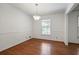 Simple dining room with hardwood floors and single window at 3449 Palace Ct, Tucker, GA 30084