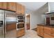 Stainless steel appliances and ample wood cabinetry highlight this kitchen at 3449 Palace Ct, Tucker, GA 30084