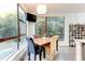 Dining area is bright with natural light and a view of the surrounding trees at 958 Moda Dr, Atlanta, GA 30316