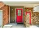 Bright red front door and secondary door, brick facade at 958 Moda Dr, Atlanta, GA 30316