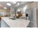 Modern kitchen island with sink and stainless steel appliances at 958 Moda Dr, Atlanta, GA 30316