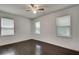 Bright bedroom with dark hardwood floors and ceiling fan at 265 Whitaker Nw Cir, Atlanta, GA 30314