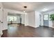 Open concept dining area with dark hardwood floors and pendant lighting at 265 Whitaker Nw Cir, Atlanta, GA 30314