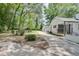 Landscaped front yard with mature trees and a long driveway leading to the house at 265 Whitaker Nw Cir, Atlanta, GA 30314