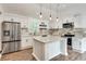 Renovated kitchen featuring granite countertops and white cabinets at 265 Whitaker Nw Cir, Atlanta, GA 30314