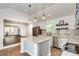 Open concept kitchen with island and view into adjacent living area at 265 Whitaker Nw Cir, Atlanta, GA 30314