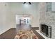 Open living room with view into kitchen and whitewashed brick fireplace at 265 Whitaker Nw Cir, Atlanta, GA 30314