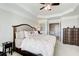 Spacious bedroom featuring a tray ceiling, large bed, and an ensuite bathroom at 4694 Wehunt Commons Se Dr # 25, Smyrna, GA 30082