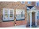 Townhome exterior detail; balcony with iron railings and double doors at 4694 Wehunt Commons Se Dr # 25, Smyrna, GA 30082