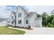 Stunning two-story home with light blue siding and a two-car garage at 6585 Rhett Run, Cumming, GA 30028