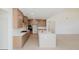 Modern kitchen with light wood cabinets and a large island at 6585 Rhett Run, Cumming, GA 30028