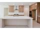 Modern kitchen with light wood cabinets and large island at 6585 Rhett Run, Cumming, GA 30028