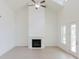 Bright living room with high ceilings and a fireplace at 6585 Rhett Run, Cumming, GA 30028