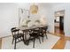 Cozy dining area with wooden table, chandelier, and doorway to the kitchen at 1044 Lindridge Ne Dr, Atlanta, GA 30324