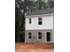 Two-story duplex with gray and white siding, featuring two windows on each level at 7240 Crestside Dr, Austell, GA 30168