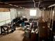 Unfinished basement offering ample storage space, exposed beams, and potential for customization; a versatile area for various needs at 218 Ward Rd, Ellenwood, GA 30294