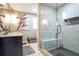 Bathroom featuring a frameless shower, dual vanity and neutral tones at 218 Ward Rd, Ellenwood, GA 30294