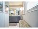 Bathroom featuring a gray vanity, dual mirrors and lots of space at 218 Ward Rd, Ellenwood, GA 30294