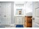 Bright bathroom featuring a vanity with storage, and a neutral color palette at 218 Ward Rd, Ellenwood, GA 30294