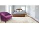 Bedroom featuring a decorative chair, soft carpet, and lots of natural light at 218 Ward Rd, Ellenwood, GA 30294