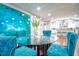 Bright dining area with a modern table setting and a clear view of the kitchen and bar seating at 218 Ward Rd, Ellenwood, GA 30294
