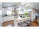 Modern kitchen with white cabinets, granite countertops, stainless steel appliances, and a center island with seating at 218 Ward Rd, Ellenwood, GA 30294